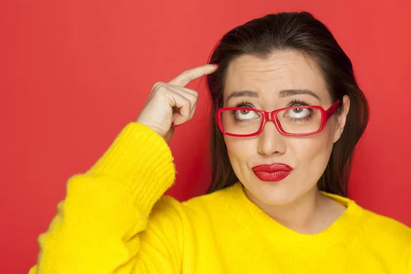 Beautiful Wondering Woman Red Frame Glasses Red Background — Stock Photo, Image