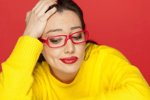 Beautiful Unhappy Woman Red Frame Glasses Red Background — Stock Photo, Image