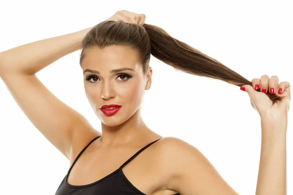 Young Beautiful Woman Showing Her Ponytail — Stock Photo, Image