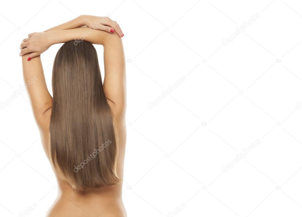 Back view of a woman with beautiful long straight hair