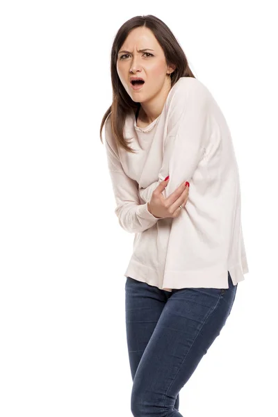 白い背景の上の胃の痛みを持つ若い女性 — ストック写真