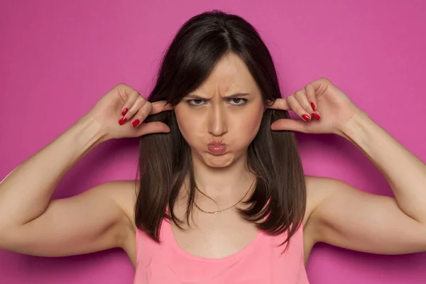 Funny Young Woman Making Silly Faces Pink Background — Stock Photo, Image