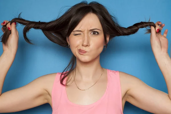 Silly Young Woman Two Ponytails Blue Background — Stock Photo, Image