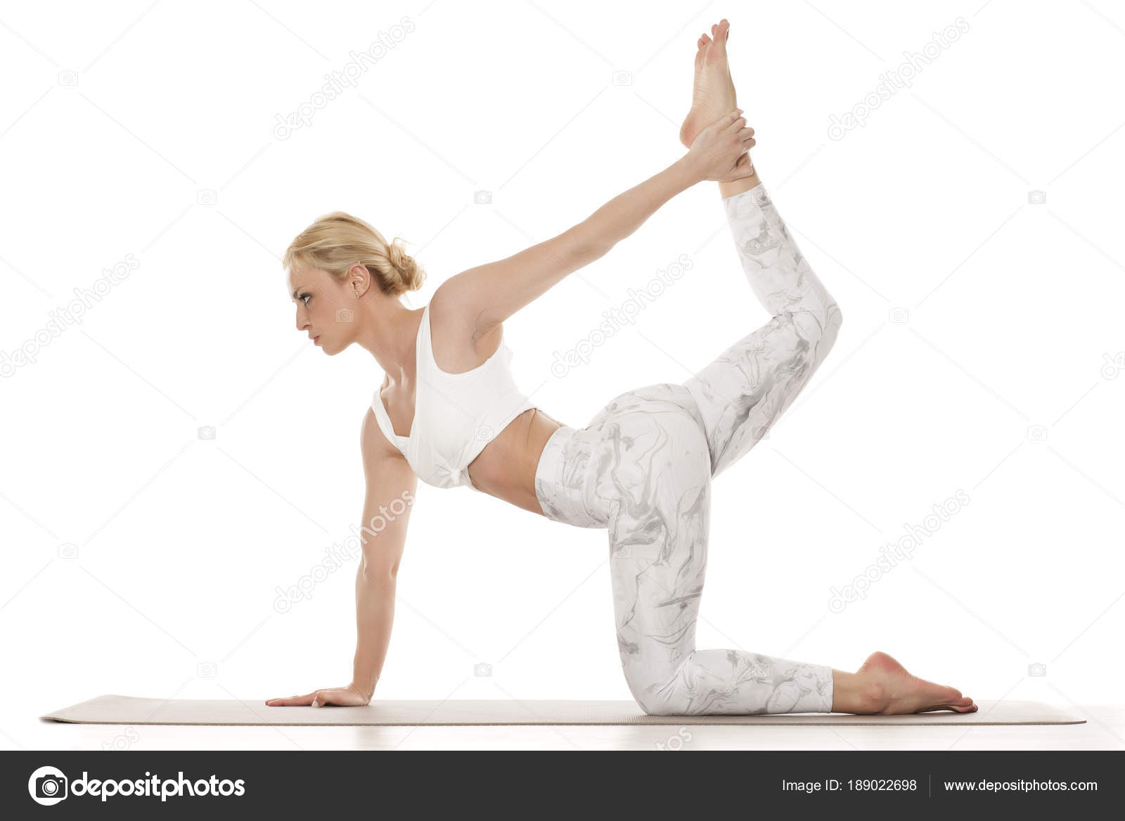 Young flexible woman exercising yoga in park Stock Photo by ©by_ShiShkin  117366806