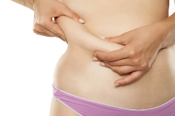 Woman Pinching Fat Deposits Her Waist White Background — Stock Photo, Image