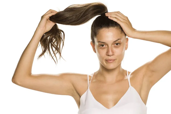 Young Woman Makeup Holding Her Panytail White Background — Stock Photo, Image