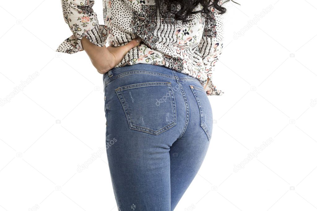 Pretty female ass in jeans on white background