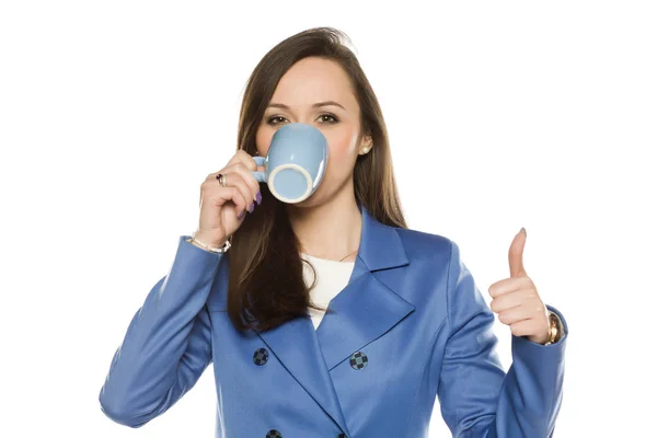 Young Business Woman Drink Mug White Background Showing Thumbs — Stock Photo, Image