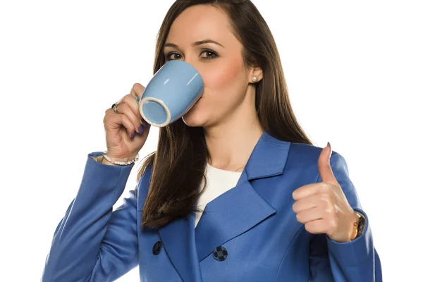Young Business Woman Drink Mug White Background Showing Thumbs — Stock Photo, Image