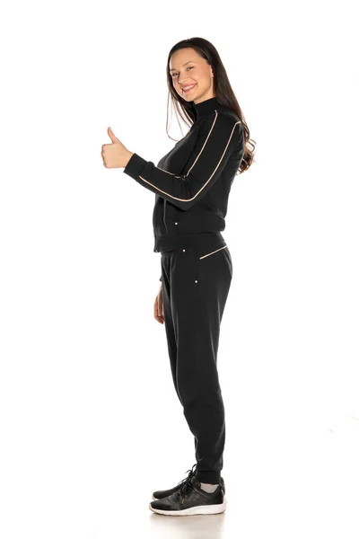 Side View Young Woman Black Track Suit Showing Thumbs White — Stock Photo, Image