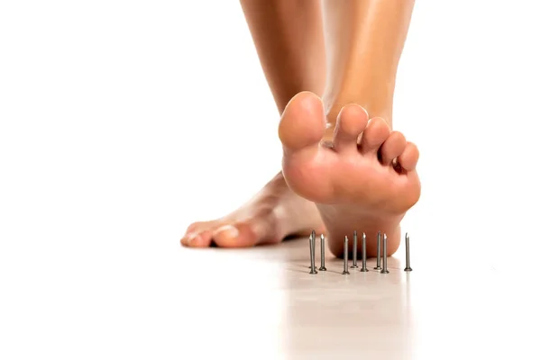 Woman Foot Stepped Nails White Background — Stock Photo, Image