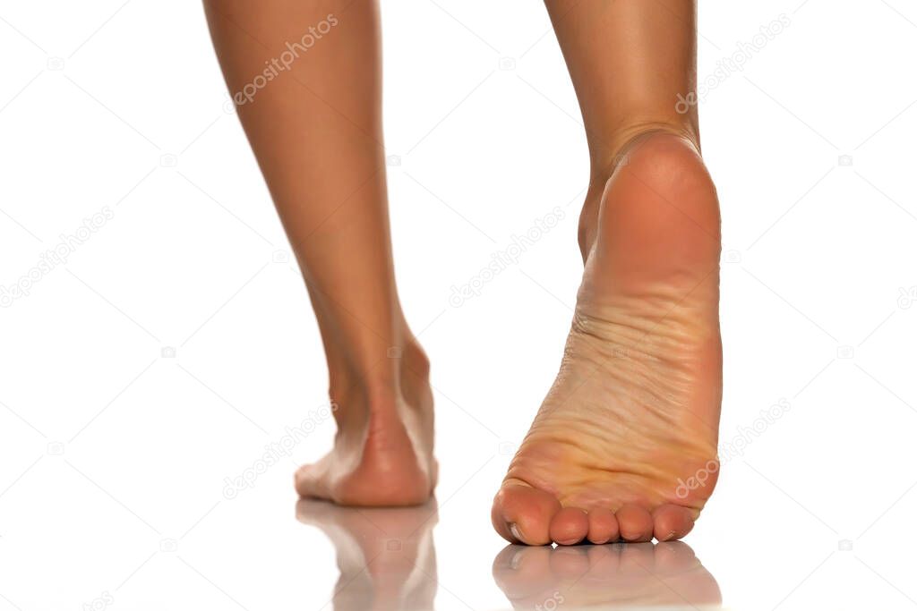 beautiful female foot on white background