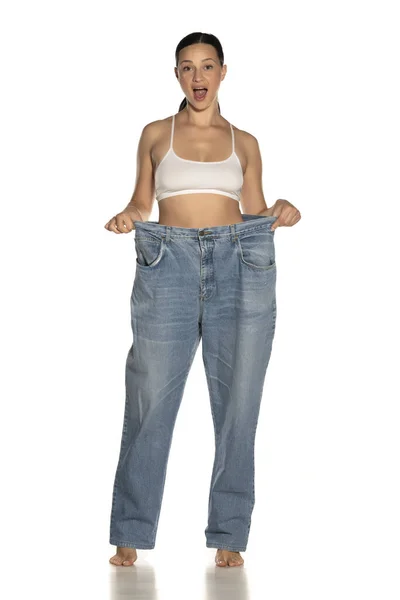 Young Slim Happy Woman Big Size Pants White Background — Stock Photo, Image