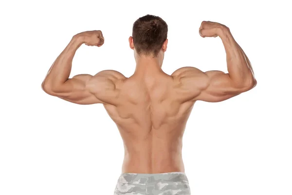 Bakifrån Den Halvnakna Stilig Och Muskulös Ung Man Poserar Vit — Stockfoto
