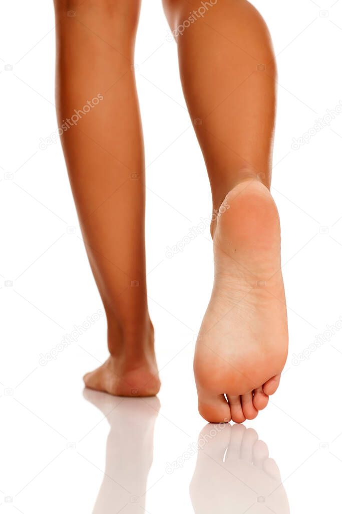 Beautiful Womens Feet On White Background Stock Photo