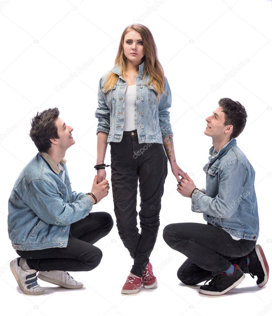 Young woman posing with two young man