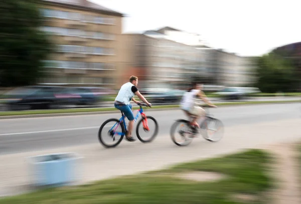 Cyclists in traffic — Stock Photo, Image