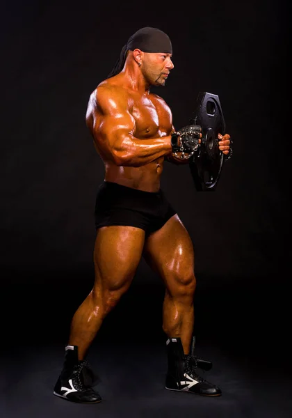 Handsome bodybuilder posing in studio — Stock Photo, Image