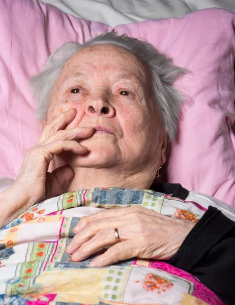 Old sick pensive woman — Stock Photo, Image