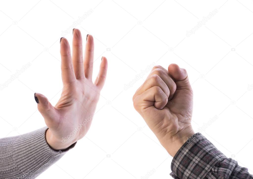 Woman making stop gesture, man showing fist 