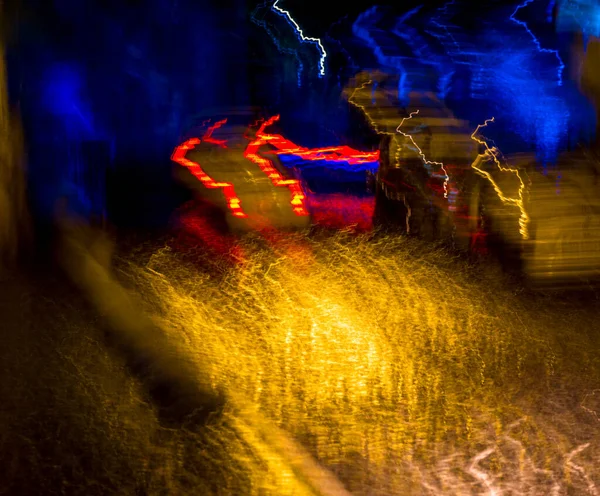 Streets after rain with reflections of light on wet roadway — Stock Photo, Image