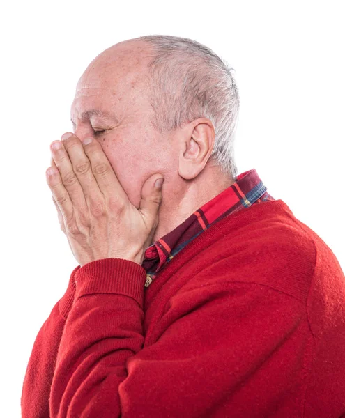 Porträtt av en äldre man med ansikte stängde av händer — Stockfoto