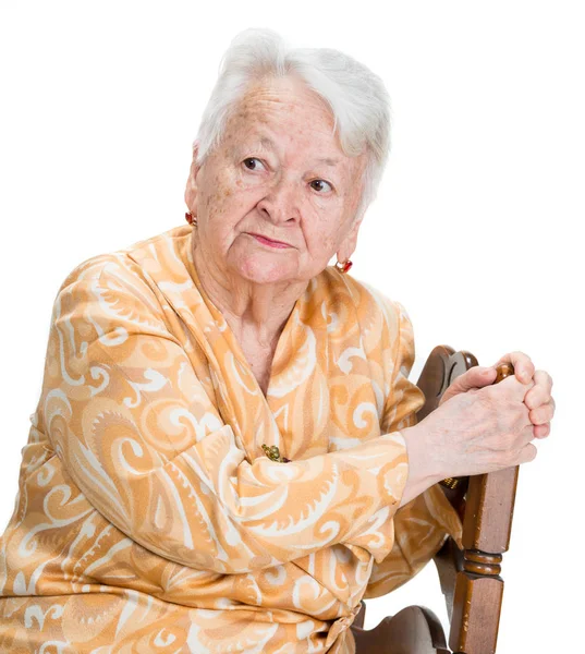 Portrait of pensive old woman posing in studio Royalty Free Stock Images