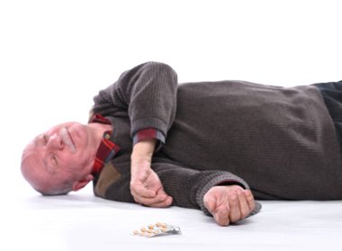 Healthcare and medicine concept. Senior man falling down from stroke or heart attack