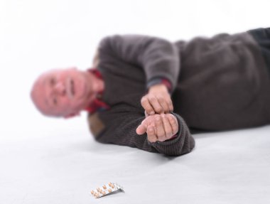 Healthcare and medicine concept. Senior man falling down from stroke or heart attack
