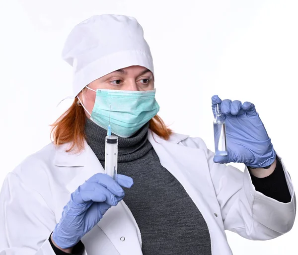 Healthcare and medicine concept. Female doctor in mask  holding — Stockfoto