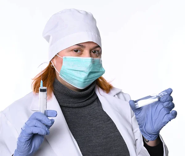 Healthcare and medicine concept. Female doctor in mask  holding — Stockfoto