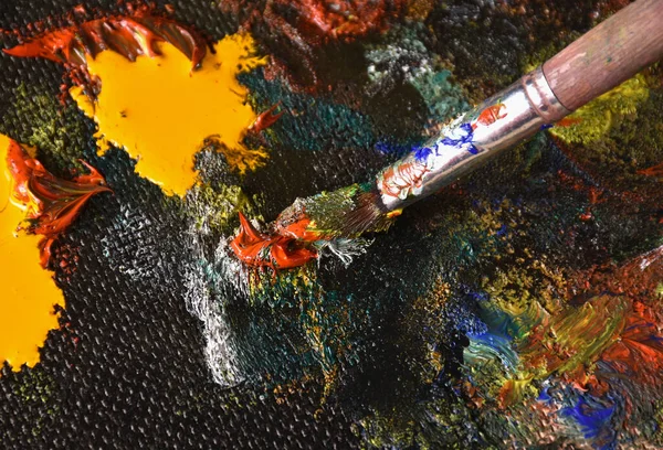 Artist mixing color oil painting on palette. Palette with paintbrush. Art palette