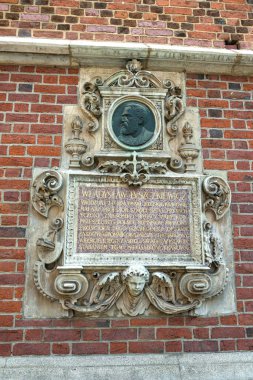 KRAKOW, POLAND - JULY 27, 2013: Beautiful architecture of old Krakow. Fragments of the decoration of buildings