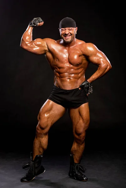 Handsome Muscular Bodybuilder Black Shorts Bandana Posing Studio Dark Background — Stock Photo, Image