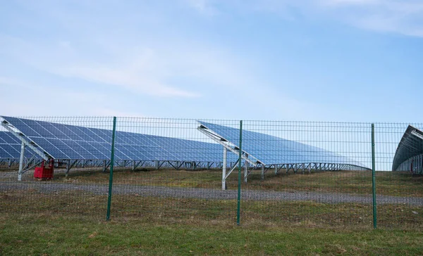 View of a solar energy station on a field. Solar panel, photovoltaic, alternative electricity source