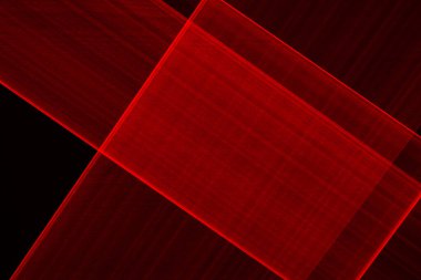 Siyah arkaplanda ışıkla çizilmiş soyut kırmızı çizgiler. Lazer hatları