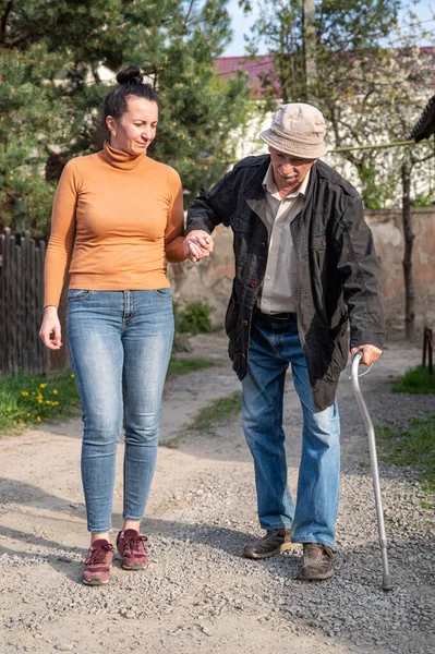 Senior Man Walking Stick Walking Granddaughter Outdoors — Stock Photo, Image