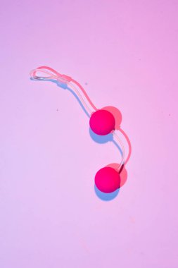 Sex toy kegel balls on a pink background, top view, flat layout  clipart