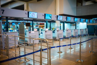 Bangkok, Thailand :February 13, 2020 - Row of vacancy check-in counters for issuing flight tickets. Crisis of tourism industry from COVID-19 outbreak at the Don Muang airport, Thailand