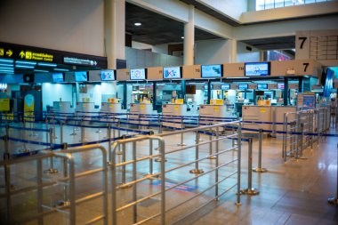 Bangkok, Thailand :February 13, 2020 - Row of vacancy check-in counters for issuing flight tickets. Crisis of tourism industry from COVID-19 outbreak at the Don Muang airport, Thailand