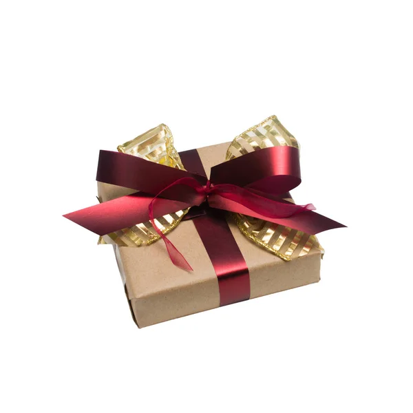 Wrapped vintage gift box with red ribbon bow — Stock Photo, Image