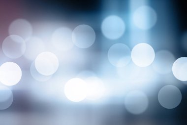 Mavi arkaplanda bulanık ışıklar ya da mavi arkaplanda ışıklar