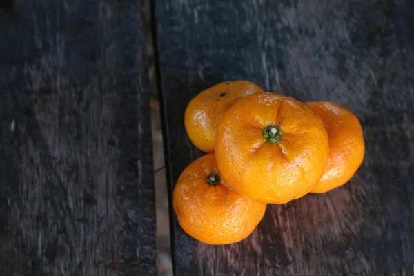 Orange fruit on wooden table — Stock Photo, Image