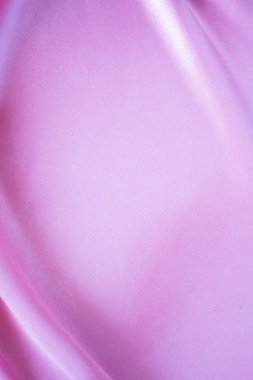 Arkaplan için pürüzsüz pembe ipek veya saten doku kullanımı.
