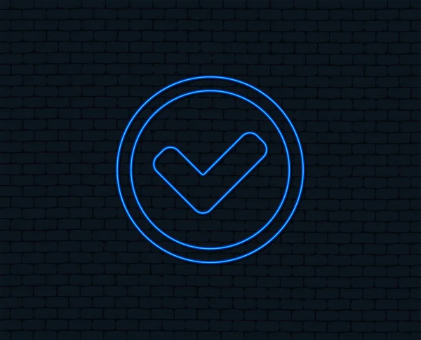 Neon light. Check mark sign icon. Yes circle symbol. Confirm approved. Glowing graphic design. Brick wall. Vector