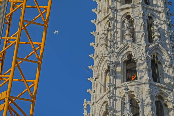Zagreb, Croatia - April 17, 2020 : Fire after explosion in operation of demolition of north tower of Zagreb Cathedral damaged by earthquake