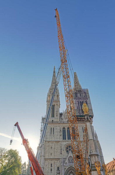 Zagreb, Croatia - April 16, 2020 : Cathedral belfries were damaged in an earthquake that hit Zagreb during Covid-19 quarantine. One of the bells fell while the other awaits controlled demolition.