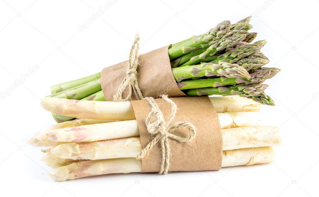 Fresh organic asparagus bunches isolated on a white background