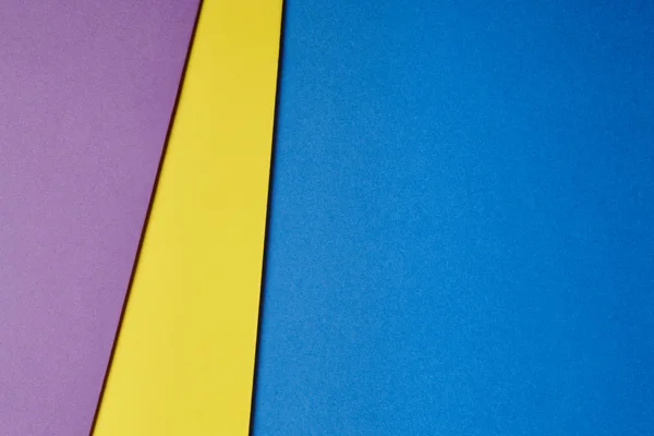 Farbige Pappen Hintergrund lila gelb blau Ton. Kopierspac — Stockfoto