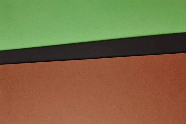 Cartolinas coloridas fundo em marrom tom verde preto. Copiar sp — Fotografia de Stock